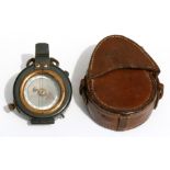 A WW1 prismatic compass in its brown leather case impressed R Stafford 1917