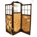 A 19th century walnut three-fold screen with glazed upper section and tapestry panels beneath,