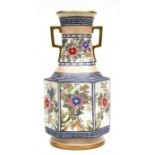 A large twin handled Noritake vase of hexagonal form decorated with flowers in enamel colours, green