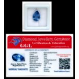A natural tanzanite loose gemstone with GGL certificate report stating the tanzanite to be 5.