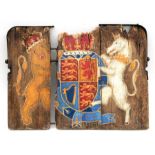 A hand painted Heraldic style iron bound wooden plaque, 74cms (29ins) wide.