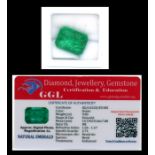 A natural emerald loose gemstone with GGL certificate report stating the emerald to be 9.85cts,