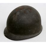 A WWII American Army helmet with leather liner.