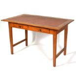 A mid 20th century design writing table with two frieze drawers, on square tapering legs, 120cms (