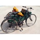 A vintage Raleigh pedal bike and wooden side-car.