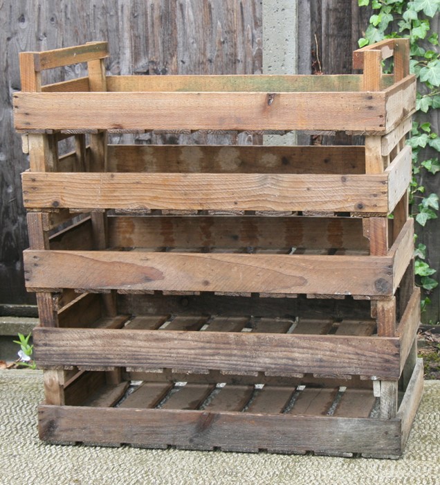 Five wooden apple crates.