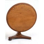 A Victorian mahogany apprentice tip top table. 23cm (9 ins) diameter