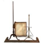 A 19th century mahogany pole screen, a brass standard lamp and a cast fire curb (3)