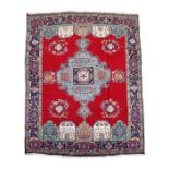 A Persian Tabriz woollen handmade carpet with central medallion within a geometric design, 367 by