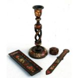 A Kashmiri lacquer open twist candlestick, a similar pen tray, letter opener and lidded box ( 4)
