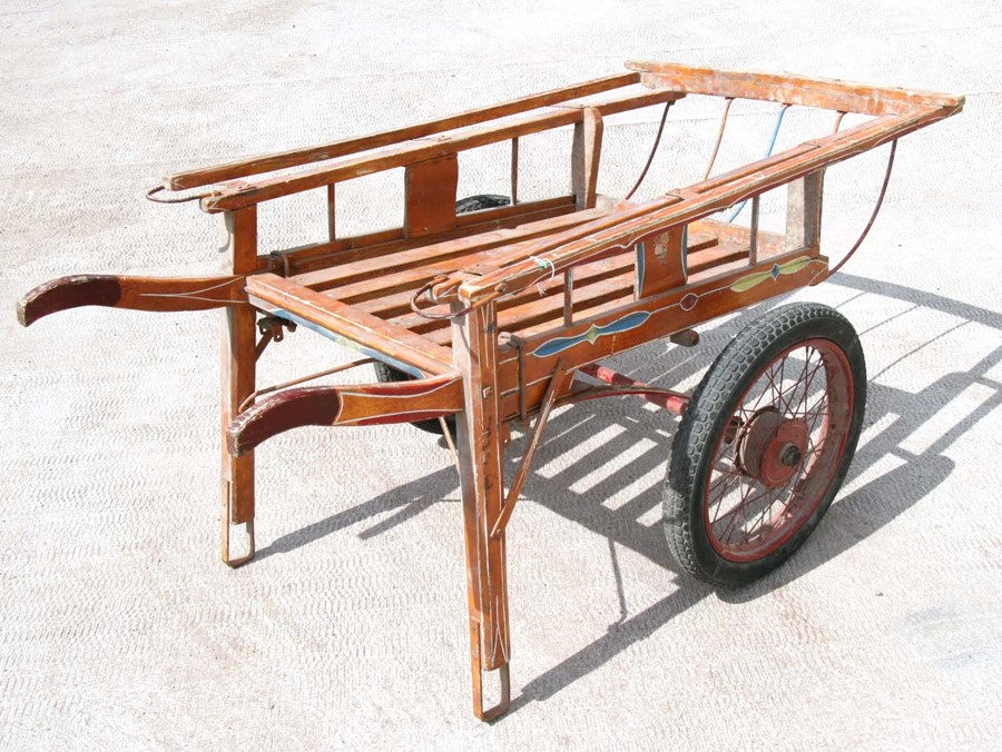 A hand painted two-wheeled hand cart, 153cms (60ins) long.