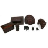 A 19th century mahogany tea caddy, a carved oak wall pocket, a craved Thai wall plaque and other