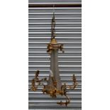 A bronze ormolu and cut glass six arm ceiling light, the naturalistic arms with rams head mounts.