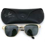 A cased pair of Signet Ray-Ban sun glasses.