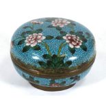 A Chinese cloisonne box & cover decorated with flowers on a turquoise ground, 12cms (4.75ins)