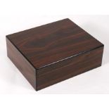 A figured rosewood humidor, 25cms (9.75ins) wide.