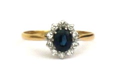 An 18ct gold diamond and sapphire ring Approx UK size P