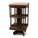 An Edwardian inlaid mahogany revolving bookcase. 48.5cm (19 ins) wide (a/f)