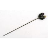An Edwardian silver twin thistle hat pin.