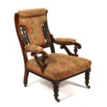A Victorian upholstered walnut arm chair