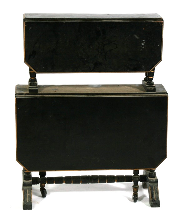 A late 19th century ebonised two tier sutherland table on ring turned supports. 61cm (24 ins) wide