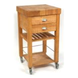 A modern pine butchers block with two drawers and undertier. 51cm (20 ins) wide