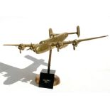 A large brass model of the WW2 heavy bomber the iconic Handley Page Halifax with spinning propellers