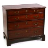 A Georgian mahogany chest with two short and three graduated long drawers standing on bracket