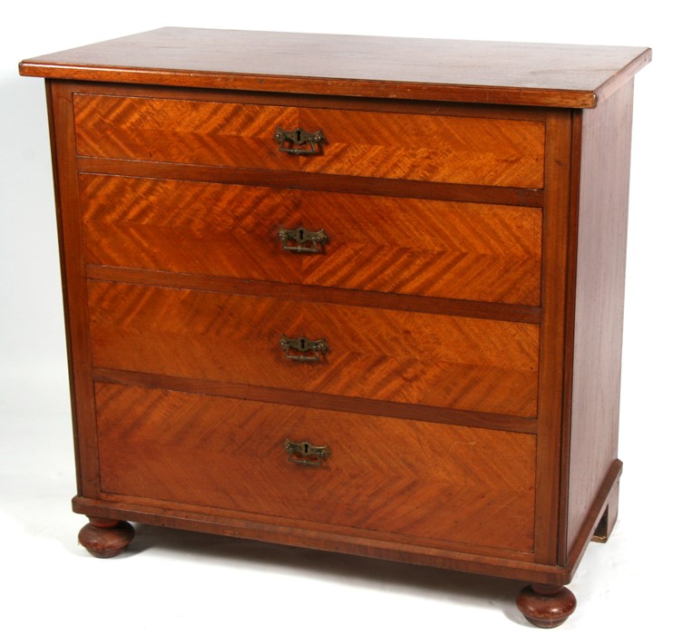 A continental walnut chest of four long graduated drawers, on bun feet, 94cms (37ins) wide.