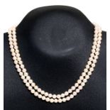 A double strand cultured pearl necklace with a silver marcasite set clasp. overall length 42cm (16.5