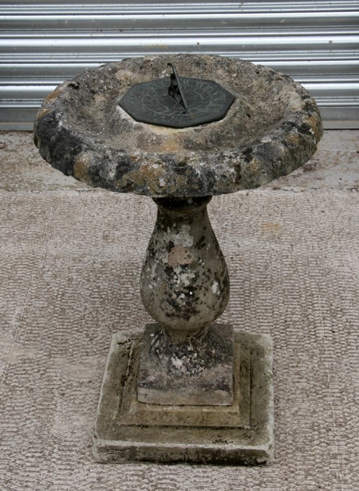 A reconstituted stone sundial bird bath, 68cms (26.5ins) high.