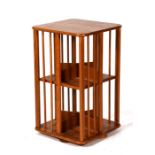 An Ercol style pale oak revolving bookcase, 45cms (17.75ins) wide.