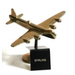 A brass model of the WW2 British heavy bomber the Short Stirling mounted on its brass base marked