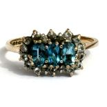 A 9ct gold dress ring set with pale blue & white stones, approx UK size 'P'.