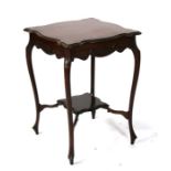 An Edwardian mahogany two-tier occasional table, 52cms (20.5ins) wide.