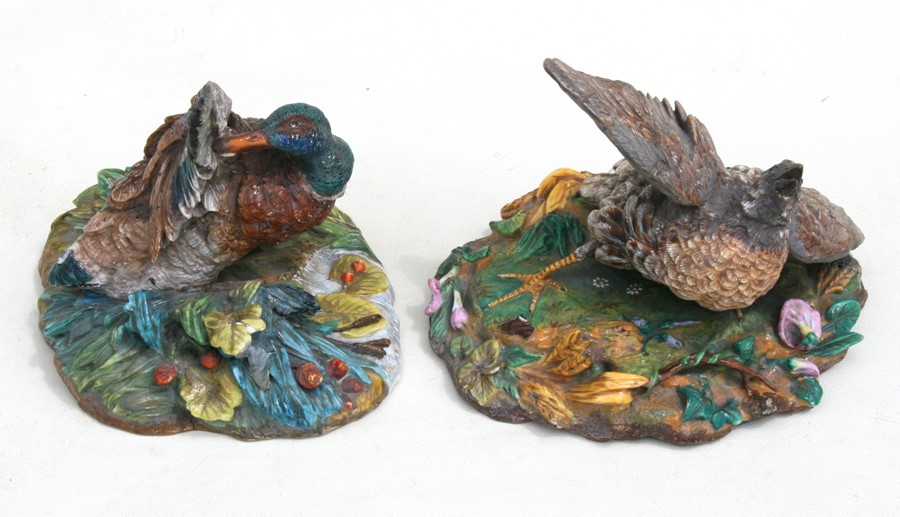 Two Jean Gille painted bisque bird groups depicting a quail and a mallard, each with JG blue