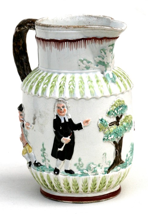 An 18th century pearlware jug moulded with 'Parson, Clark & Sexton', smoking and drinking,