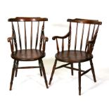 A pair of elm stick back carver chairs (2).