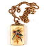 A yellow metal (tests as gold) mounted rectangular pendant hand painted with birds, on a 9ct gold