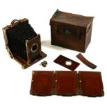 A G Hare mahogany and brass plate bellows camera with three spare plates and lens, cased.