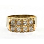 A 9ct gold & diamond ring, set with eight diamonds, approx UK size 'O'.