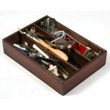 A 19th century mahogany three-division cutlery box containing a quantity of flatware.