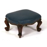 A mahogany footstool on cabriole legs, 36cms (14ins) wide.