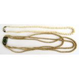 A triple-strand pearl necklace with silver clasp and a similar single strand necklace (2).