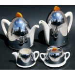 An Art Deco KK tea set with chrome covers and phenolic handles, consisting a teapot, hot water