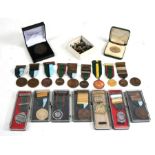 A collection of 19 Shooting Medals and Medallions together with 37 separate Clasps including Bisley,