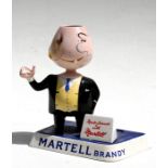 A Carltonware Martel Brandy advertising figure, 20cms (8ins) high (a/f).