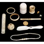 A quantity of late 19th and early 20th century ivory items to include a puzzle ball on stand, a