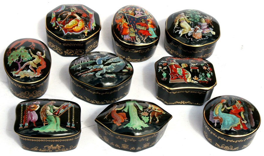 A group of nine Franklin Mint porcelain music boxes.