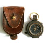 A WW1 brass compass marked to the underside F-L No.103571. 1917. in its brown leather carry